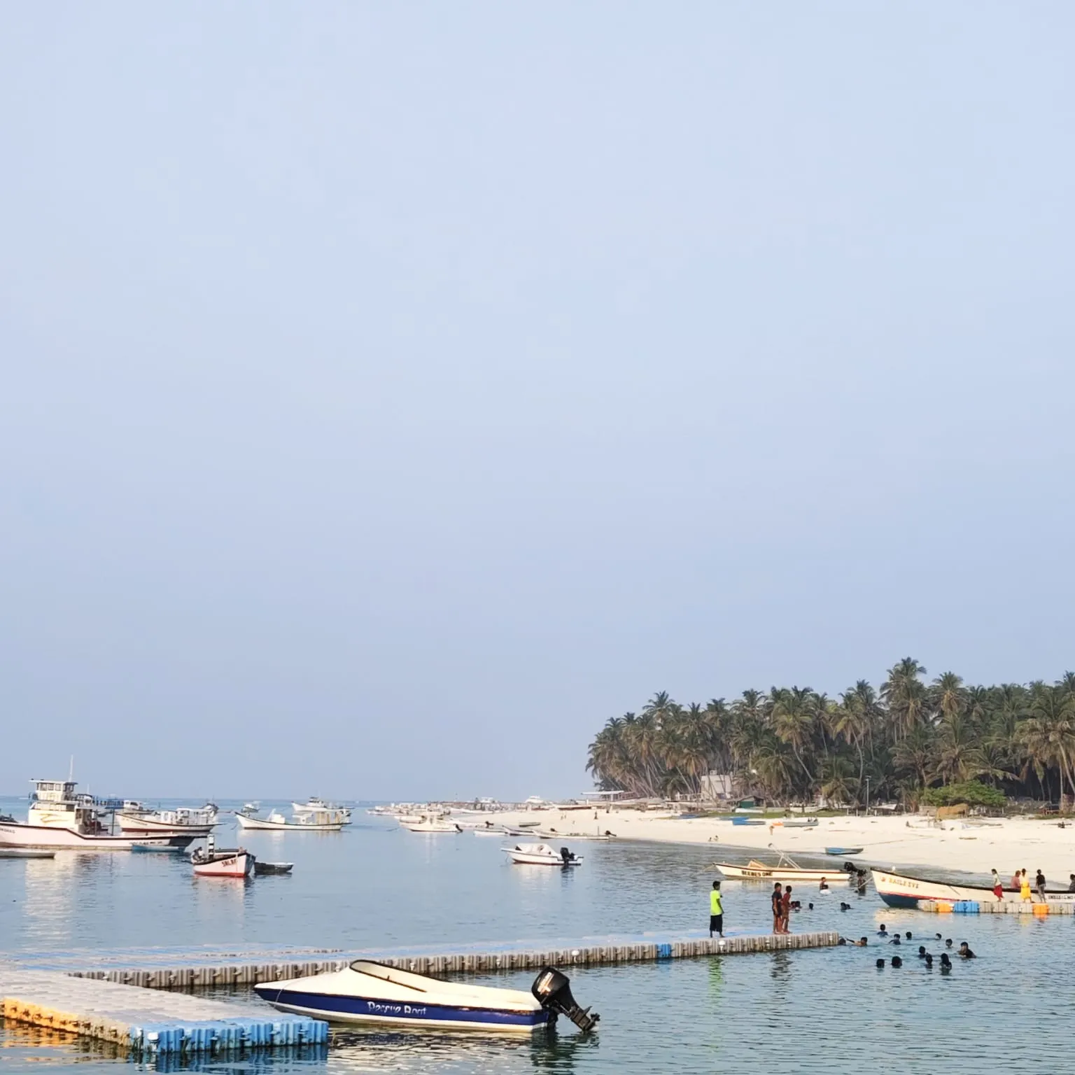Boats at the jetty on the Agatti lagoon